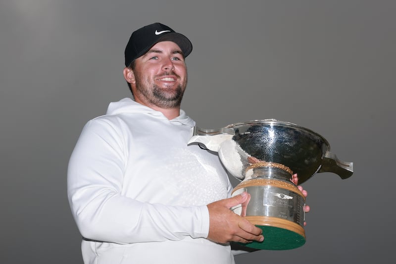 Chris Gotterup of the United States poses for a photograph with the Genesis Scottish Open. Photograph: Warren Little/Getty