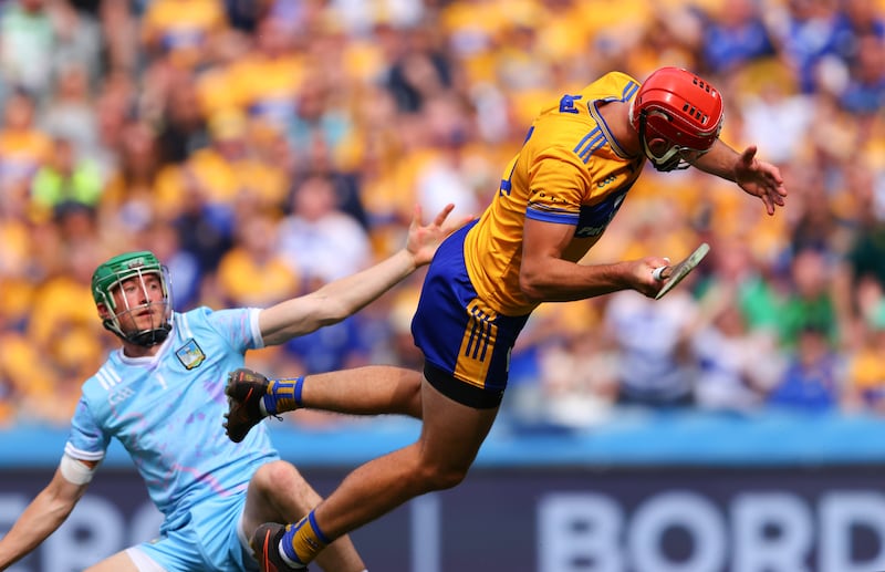 Clare's Peter Duggan is fouled by Nickie Quaid of Limerick in the hurling championship semi-final. Photograph: Tom O’Hanlon/Inpho