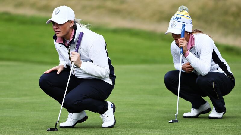 Charley Hull  and Azahara Munoz line up putts during the 2019 Solheim Cup at Gleneagles. Photograph: Jamie Squire/Getty Images