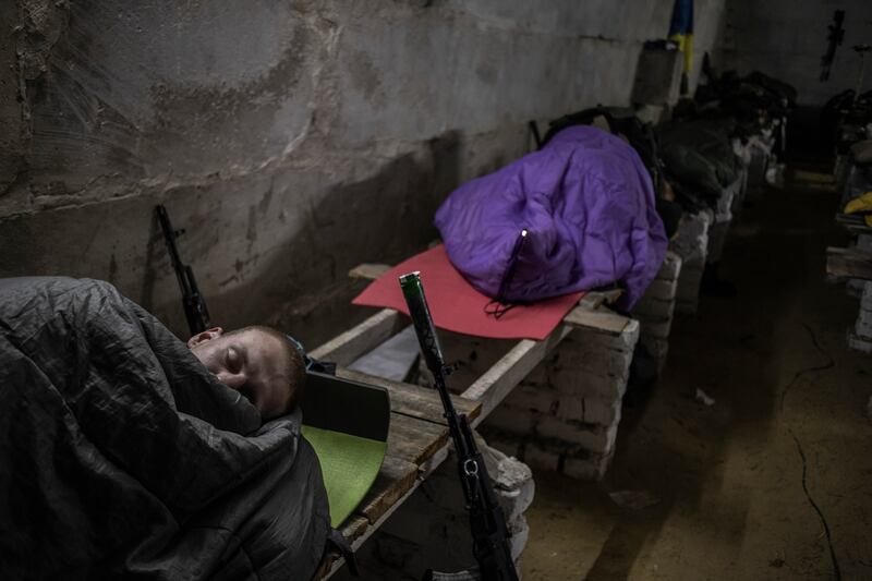 Ukrainian soldiers  sleep in an abandoned farmhouse along the frontline in the Donetsk region near Izyum, Ukraine on May 26th.