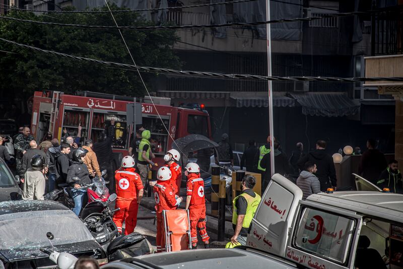 First responders at the scene of an attack in Lebanon. Photograph: Sally Hayden
