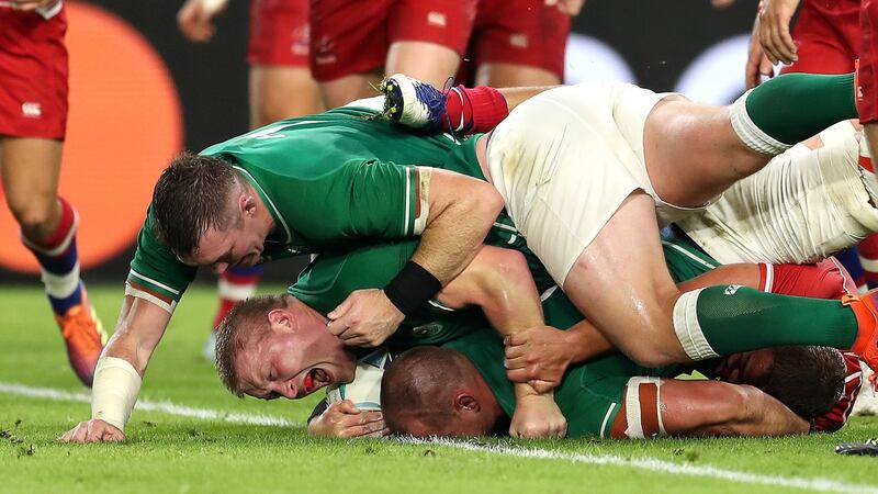 Rhys Ruddock scores his team’s third try as John Ryan celebrates. Photo: Mike Hewitt/Getty Images