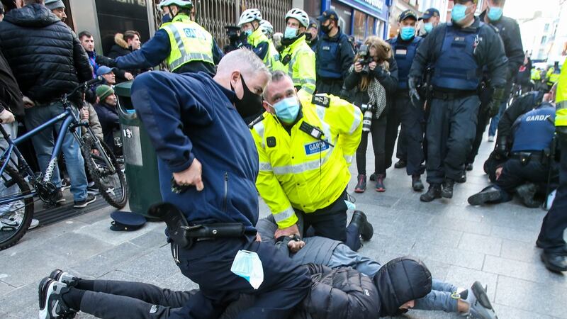 Violence flares as anti-lockdown protestors clash with gardaí on Dublin’s Grafton Street on Thursday. Photograph: Damien Storan