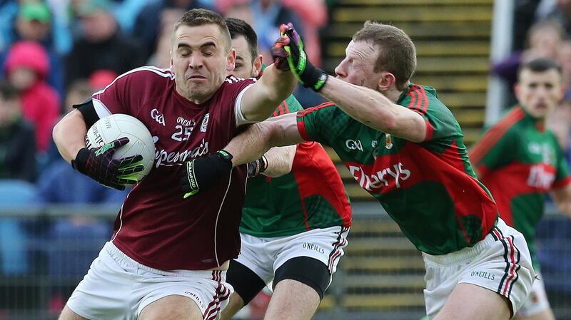 Mayo’s Colm Boyle tackles Galway’s Patrick Sweeney. Photograph: Lorraine O’Sullivan/Inpho