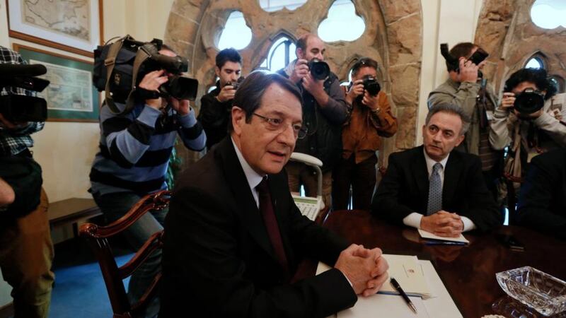 Cyprus' President Nicos Anastasiades (centre) chairs a meeting with party leaders.  Photograph: Reuters