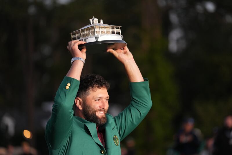 Jon Rahm holds up the Masters trophy after winning the Masters Tournament at Augusta National. Photograph: Doug Mills/The New York Times