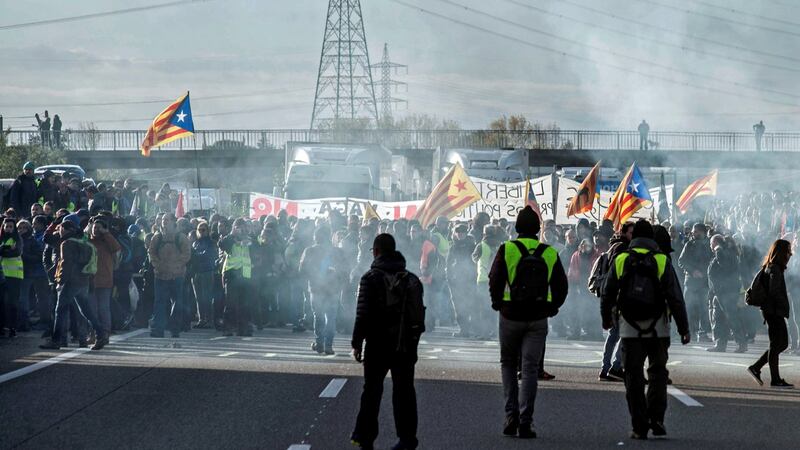 Protesters block the AP-7 road in Figueres  on Wednesday, as part of a strike called in Catalonia  to protest against the imprisonment of pro-independence leaders. Photograph: Robin Townsend/EPA