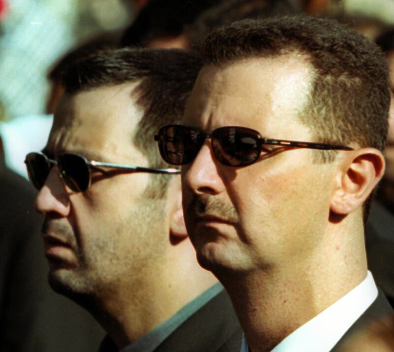 Maher and Bashar Assad in 2000. Photograph: Ramzi Haidar/AFP via Getty Images