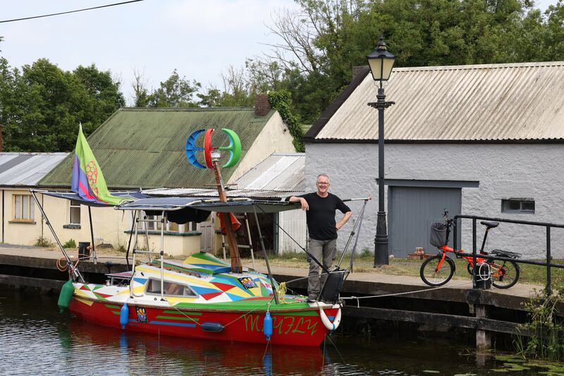 Denis Connolly on the prow of Mayfly Eco at Vicarstown, Co Laois. The summer journey of the Eco Showboat from the Shannon estuary through the Grand Canal and Barrow to Howth. Photograph Nick Bradshaw/The Irish Times