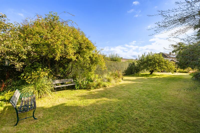 The long back garden is mainly in lawn