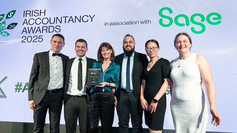 Carmel Nielsen, business development manager, Search4Less, presents the online practice of the year award to Borgo team