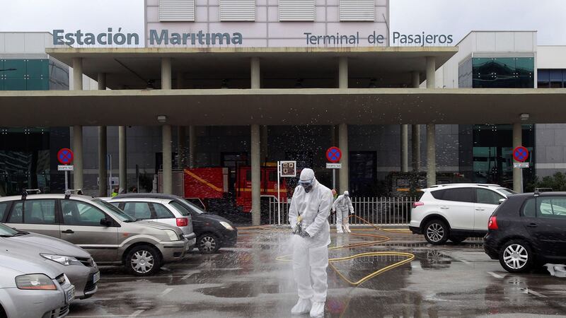 Members of Spain’s army emergency unit  disinfect the port of Algeciras in southern Spain, on Thursday. 19 March 2020. Spanish faces its fifth day of lockdown to contain the spreading of coronavirus outbreak. EPA/A.Carrasco Ragel