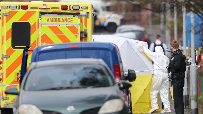 Police forensic officers at the scene of a Saturday morning shooting at a house on Etna Drive in the Ardoyne area of Belfast. The PSNI confirmed one man died in the shooting. Photograph: Niall Carson/PA Wire