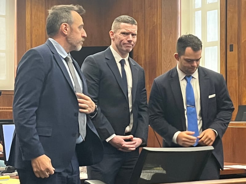 Dublin Fire Brigade member Terence Crosbie (centre) alongside his defence lawyers Daniel C Reilly (left) and Patrick Garrity during his trial in a Boston court. Photograph: Susan Zalkind