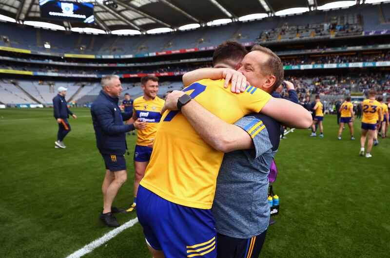 Clare's Jamie Malone celebrates with manager Colm Collins after the win over Roscommon. Photograph: Bryan Keane/Inpho