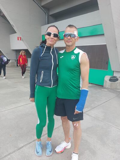 Carlton Haddock who helped the Irish M40 team win gold in the 4x400m relay despite breaking his arm two days previously, with fellow competitor Annette Quaid in Finland.