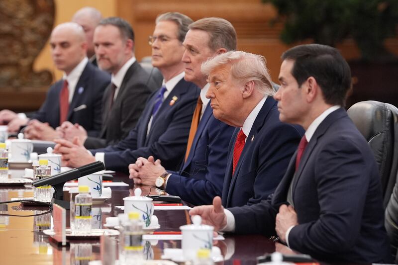 US president Donald Trump listens as he meets with China’s president Xi Jinping at the Great Hall of the People. Photograph: Mark Schiefelbein/AP