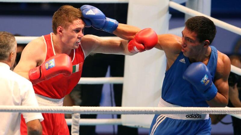 Jason Quigley in action against Zanibek Alimkhanuly   during the Middleweight final. Photograph: Cathal Noonan/Inpho