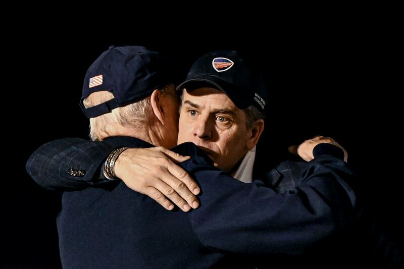 US president Joe Biden hugs his son Hunter after their trip together to Ireland in April. Photograph: Kenny Holston/New York Times
                      