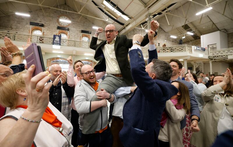 Fine Gael's Ray McAdam celebrates  his election to Dublin City Council from the North Inner City LEA  with friends, family and colleagues including the Minister for Public Expenditure Paschal Donohoe, who has his arms aloft  Photograph Nick Bradshaw 