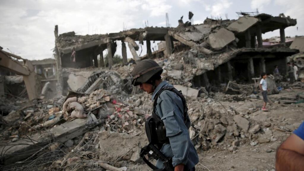 An Afghan policeman at the site of a massive truck bomb blast in Kabul on August 7th, 2015. Photograph: Ahmad Masood/Reuters