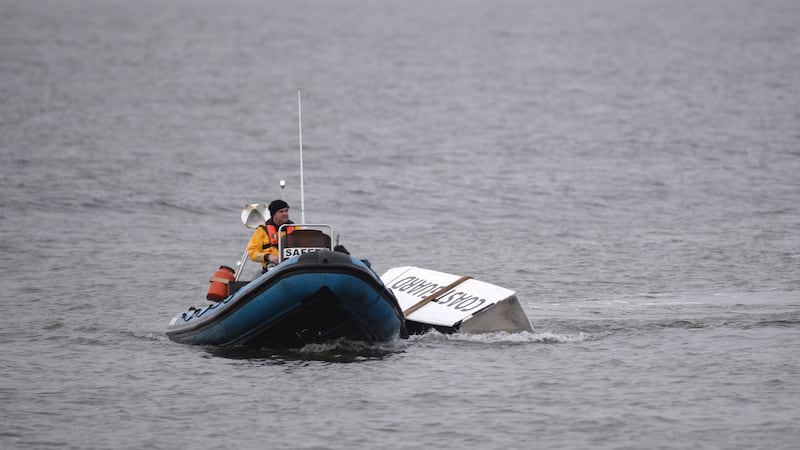 Debris from the Rescue 116 helicopter being taken to the pier in Blacksod,  Co Mayo. Photograph: Dara Mac Dónaill
