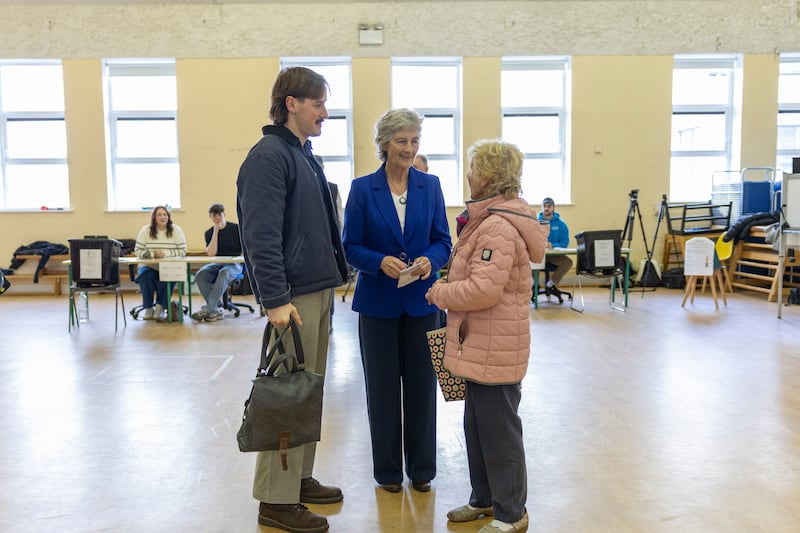 Independent candidate Catherine Connolly cast her vote in Galway city, alongside her son Stephen. Photo: Dan Dennison