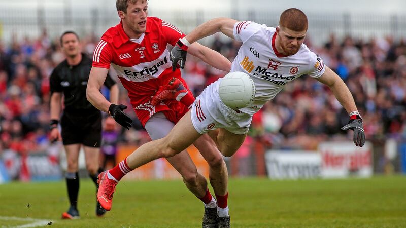 Tyrone’s Cathal McShane and Derry’s Brendan Rogers. Photograph: Lorcan Doherty/Inpho
