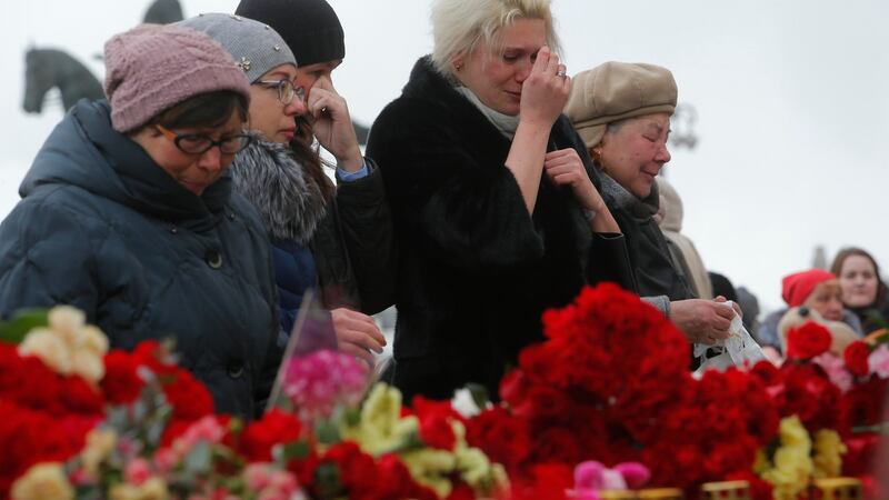 People gather to commemorate the victims of a shopping mall fire in Kemerovo on the day of national mourning in central Moscow on Wednesday. Photograph:  Sergei Karpukhin/Reuters