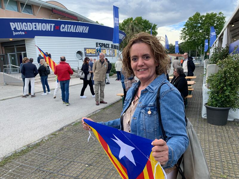 A supporter of Carles Puigdemont at a campaign rally on the French border with Spain. Photograph: Guy Hedgecoe
