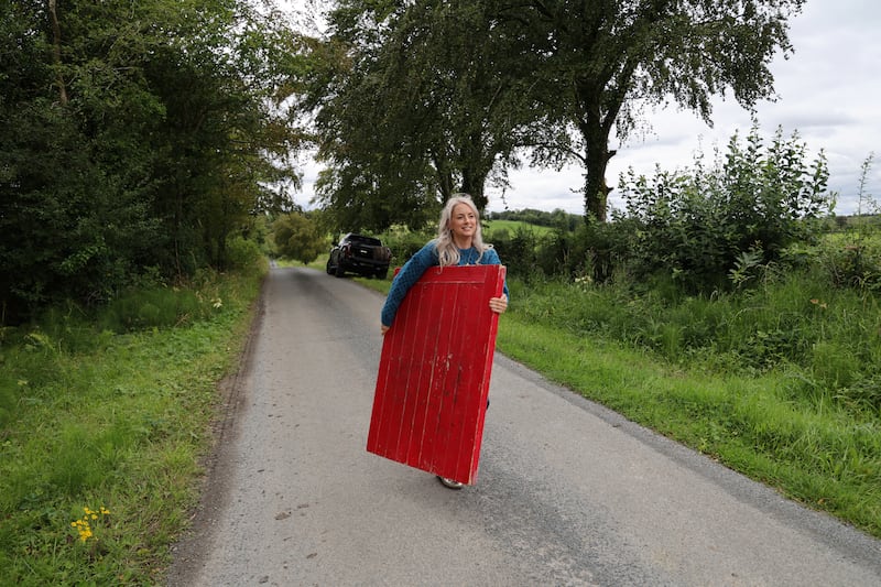 Edwina Guckian hauls her stage, a door she uses to dance on. Photograph: Bryan O’Brien