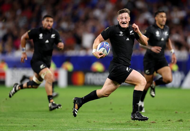 Cam Roigard of New Zealand runs with the ball against Italy. Photograph: Cameron Spencer/Getty