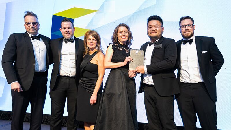 Ciara Delahunt, operations manager, SIG, presents the Fit Out Project of the Year - Medium Office award to IA Interior Architects team.