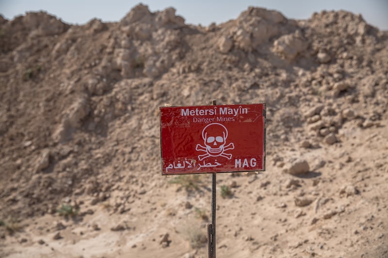 A sign planted by the Mine Advisory Group NGO marks out a minefield in northern Syria. Photograph: Sally Hayden