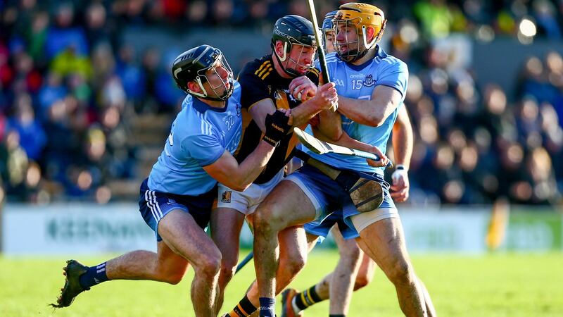 Conor Delaney is tackled by Mark Schütte and Eamon Dillon. Photo: Ken Sutton/Inpho