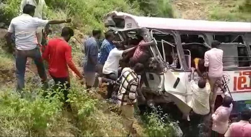 Passengers are rescued from the bus after it fell in to the gorge Photograph: AP/KK Production