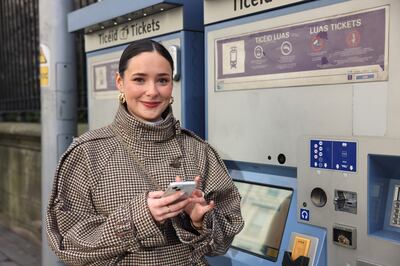 Gwenaelle Ní Dhonnabhain at a ticket-vending machine as Luas Green Line services remained suspended. Photograph: Dara Mac Dónaill