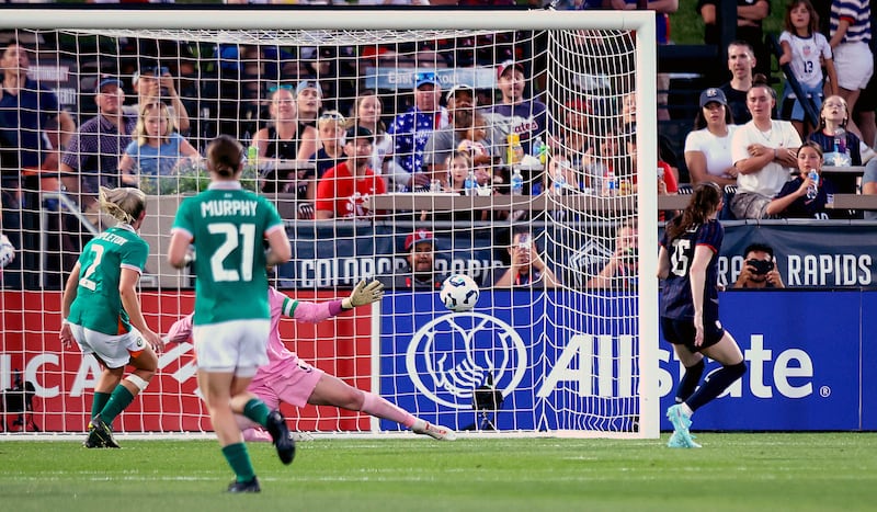 USA’s Rose Lavelle scores her side’s third goal of the game past Courtney Brosnan. Photograph: Ryan Byrne/Inpho