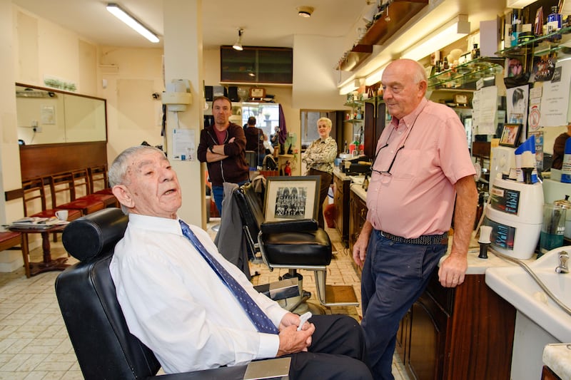 Mick Moriarty with customer Tim Crowley in the chair.
Photograph: Daragh Mc Sweeney/Provision