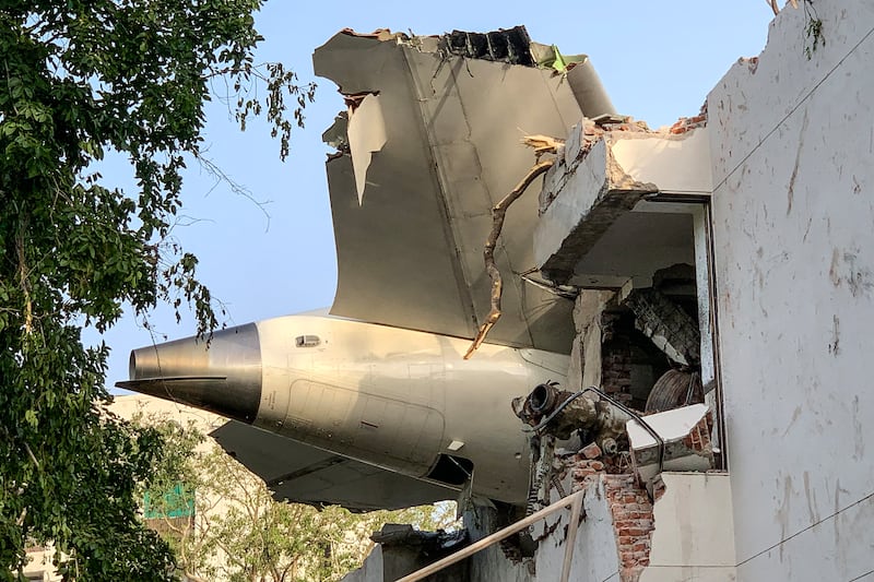 The back of Air India flight 171 is pictured at the site after it crashed in a residential area near the airport in Ahmedabad on June 12th, 2025. Photo by Sam PANTHAKY/AFP via Getty Images