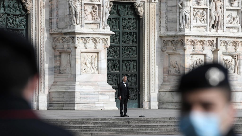 Italian tenor Andrea Bocelli sings at a deserted Piazza del Duomo in central Milan on Sunday. Photograph: Piero Cruciatti/ AFP/Getty Images