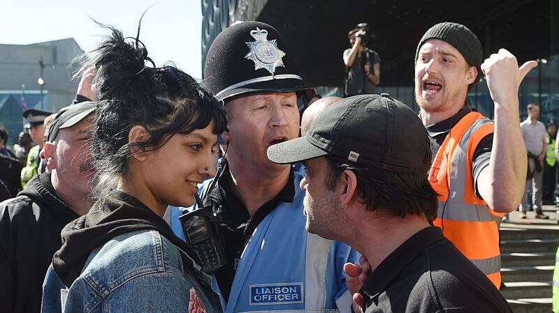 Saffiyah Khan staring down English Defence League protester Ian Crossland during a demonstration in Birmingham. Photograph: Joe Giddens/PA