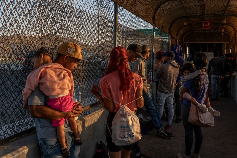 Venezuelan migrants waiting to cross from Ciudad Juarez, Mexico, into the US. Photograph: Alejandro Cegarra/New York Times
                      