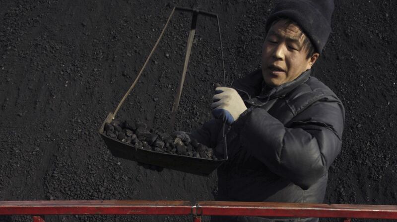 A labourer in a coal plant in Xining, northwest China. Photograph: Stringer/Reuters