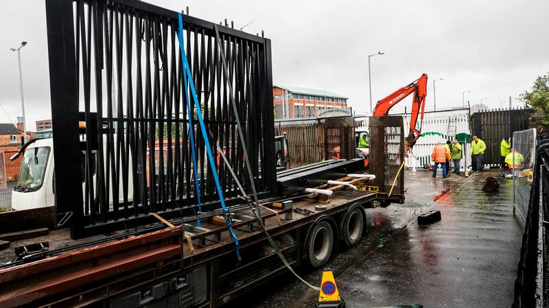 A new security gate is being installed at the Townsend Street interface, which forms  part of the peace wall in Belfast. Photograph: Liam McBurney/PA