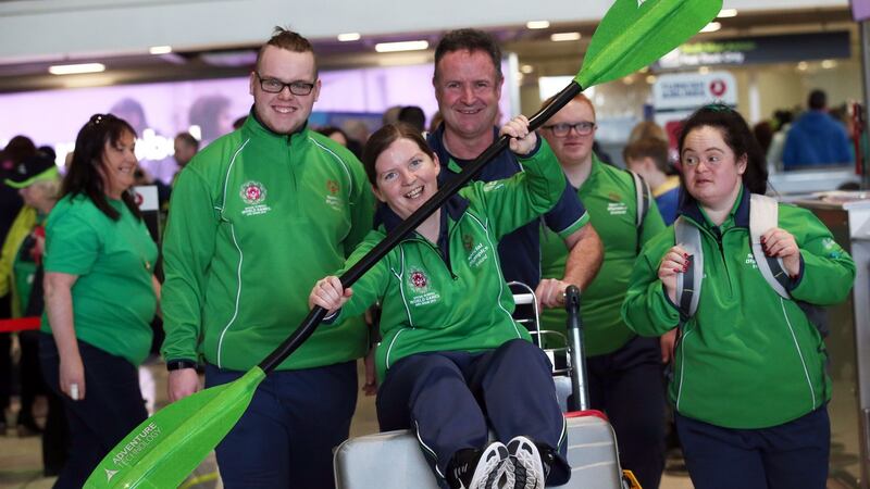 Kayaking coach Angelina Foley is pushed by her team at Dublin Airport as Team Ireland depart for the 2019 Special Olympics World Summer Games in Abu Dhabi. Photograph: Laura Hutton/The Irish Times