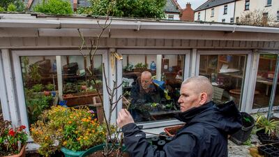 Terry Byrne inside the glasshouse and Phillip Curtis working at the horticultural project at St Andrew’s Resource Centre, Pearse St, Dublin. Photograph: Brenda Fitzsimons