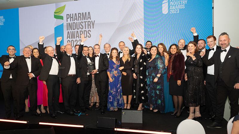 Adam O'Sullivan, commercial director at Kuehne+Nagel, presents the pharma industry company of the year award to Janssen Sciences Ireland team