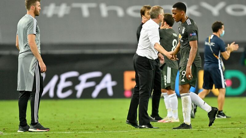 Manchester United manager Ole Gunnar Solskjaer consoles Anthony Martial as Manchester United are knocked out of the Europa League. Photograph: Martin Meissner/Pool via Getty