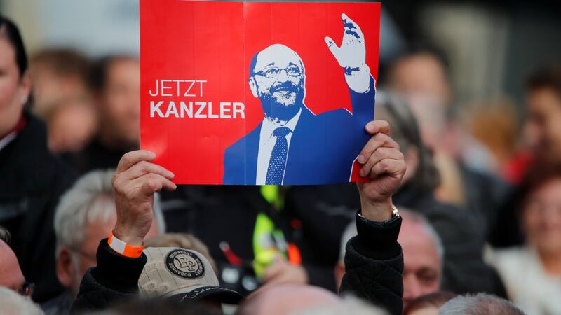 A supporter of SPD leader  Martin Schulz holds a placard reading “Now chancellor” during a campaign rally. Photograph: Wolfgang Rattay/Reuters